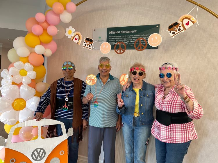 Cambridge residents enjoying a colorful ‘70s celebration during Assisted Living Week. Pictured (L-R) are Ruth Jenkison, Satish Gupta, Bette Salmon and Joy Fagan.